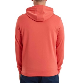 Model wearing Footjoy hoodie in Solid Nantucket Red, rear view, lightweight pullover with hood, paired with navy trousers.