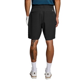 Model wearing Lyle & Scott Golf shorts in Jet Black, rear view, styled with white socks and golf shoes.