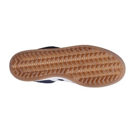 Navy and white trainer sole view showing herringbone-patterned tan gum rubber outsole with central grooves