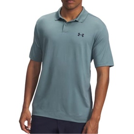 Model wearing Under Armour polo shirt in Jasper Blue, short sleeves, textured fabric, logo embroidered on chest, styled with dark trousers