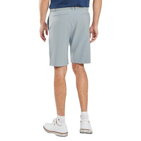 Model wearing Footjoy grey men's shorts, shown from behind, styled with white golf shoes and a navy belt.
