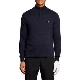 Model wearing Lyle & Scott Golf dark navy quarter-zip knit top with logo badge, styled with black trousers and white golf glove.