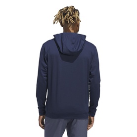 Model wearing Adidas Golf hoodie in Collegiate Navy, rear view showing hood and full-length back detail.