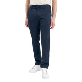 Model wearing Calvin Klein Golf navy trousers, styled with a white shirt and white trainers