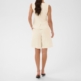 Model wearing Kaffe Feather Gray Melange tailored vest and matching wide-leg shorts, styled with black kitten heel mules