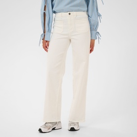 Model wearing Kaffe chalk wide-leg trousers with a light blue tie-sleeve top and white trainers