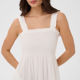 Model wearing Kaffe chalk dress with smocked bodice, frilled shoulder straps and relaxed fit