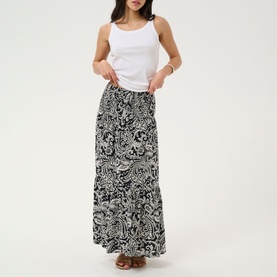 Model wearing Kaffe Black Chalk Paisley maxi skirt with tiered hem and elasticated waist, styled with a white sleeveless top.