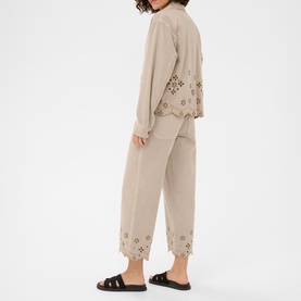 Model wearing Kaffe Feather Gray broderie anglaise co-ord set with cropped trousers, styled with black flat sandals