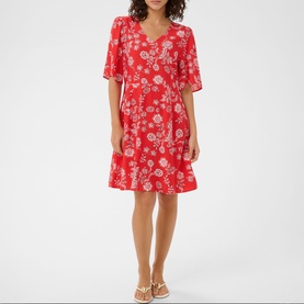 Model wearing Kaffe dress in Poppy Red Chalk Flower, flutter sleeves, V-neck, floral print, styled with strappy heeled sandals