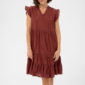 Model wearing Kaffe henna tiered mini dress with flutter sleeves, pintuck bodice detail and V-neckline