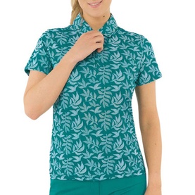 Model wearing Pure Golf teal short-sleeve polo shirt with tonal leaf print and zip neck collar.