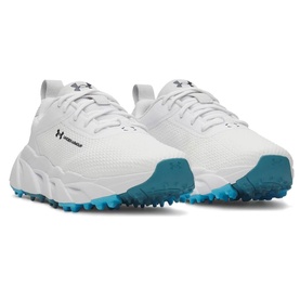 Under Armour women's golf shoes in white with teal spiked outsole, mesh upper and H branding, shown as a pair.