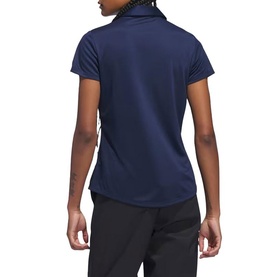 Model wearing Adidas Golf women's polo shirt in Collegiate Navy, short sleeves, back view, styled with black trousers