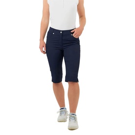 Model wearing Pure Golf navy shorts with five-pocket styling, paired with a white top and grey trainers