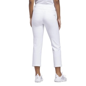 Model wearing Adidas Golf white cropped trousers, rear view, styled with white trainers