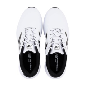 New Balance golf shoes in white with black logo detail, black laces, and cushioned insole, overhead view