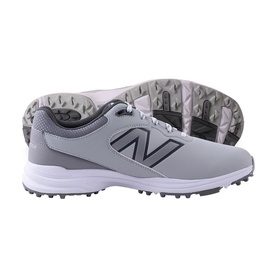 Grey and white New Balance spiked golf shoes with dark grey N logo, lace-up design, and white rubber spiked outsole