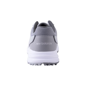 New Balance grey golf shoe, rear view showing spiked white outsole and mesh upper with embossed logo