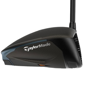 TaylorMade golf driver in dark carbon colourway, showing aerodynamic crown detail and branded sole with orange accent