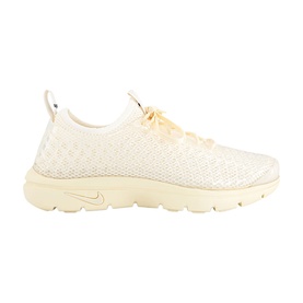 Nike trainer in Muslin and Pale Ivory, featuring a textured knit upper, lace fastening, and tonal rubber sole.