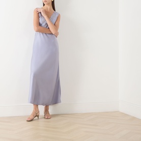 Model wearing Rixo dusty blue sleeveless midi dress with lace trim detailing, styled with nude strappy heeled sandals