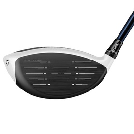 TaylorMade golf driver head, white and black with blue shaft, face-on view showing Twist Face technology and alignment markings