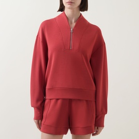 Model wearing Varley Davidson Half-Zip Sweatshirt in bossa nova with matching shorts, featuring bomber collar and half-zip fastening