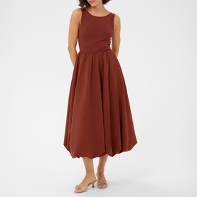 Model wearing Kaffe henna sleeveless midi dress with fitted bodice and full gathered skirt, styled with nude heeled sandals