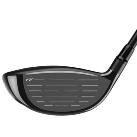 TaylorMade golf driver in black, face-on view showing Twist Face technology and horizontal grooves across the clubface.