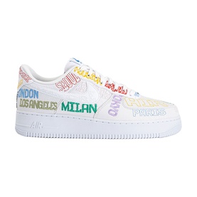 Nike low-top trainer in white with multicolour city-name print throughout, white swoosh, and white rubber sole.