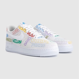 Nike Air Force 1 trainers in white with multicoloured city name graphics, low-top silhouette, white rubber sole