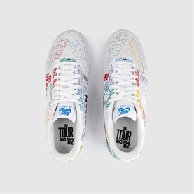 Nike white trainers with multicolour graffiti-style text print and Tour 82 branding, top-down view showing both shoes