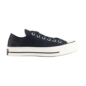 Converse Chuck 70 low-top trainer in navy canvas with white lace-up front, black heel tab, and off-white cupsole