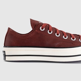 Converse Chuck Taylor platform low-top trainer in smoked paprika, suede upper, white laces, cream and black chunky platform sole.
