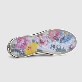 Converse trainer sole in Smoked Paprika Egret Black with multicoloured floral print and off-white rubber outsole edge.
