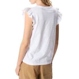 Model wearing Whistles white sleeveless top with frill shoulders, styled with tan trousers, seen from the back.