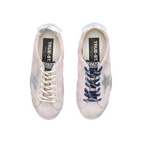Golden Goose pink suede trainers, silver star detail, navy blue laces, white rubber sole, overhead flat lay view