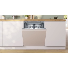 Bosch fully integrated dishwasher with silver control panel, shown installed in a white fitted kitchen with wooden worktop.