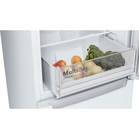 Bosch white fridge freezer MultiBox drawer detail, shown open with fresh vegetables and fruit inside