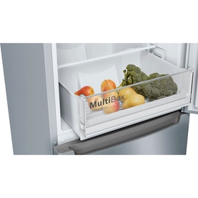 Bosch silver fridge MultiBox drawer pulled open, filled with fresh fruit and vegetables including broccoli and oranges