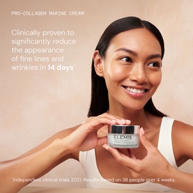 Model with Elemis Pro-Collagen Revitalise & Rejuvenate Routine skincare set, holding open glass cream jar, smiling