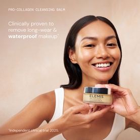 Model with Elemis Pro-Collagen Prep & Replenish Routine skincare set, holding cleansing balm jar, smiling against neutral background