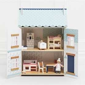 Le Toy Van Daisylane dolls house open to reveal two furnished floors with wooden furniture, bunk beds, kitchen, and doll figure