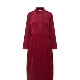 Masai Tibetan Red cotton shirt dress with collar, long sleeves, and pleated midi skirt silhouette