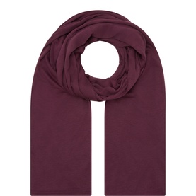 Masai burgundy modal scarf, draped in a loose coiled style showing its lightweight, oversized silhouette