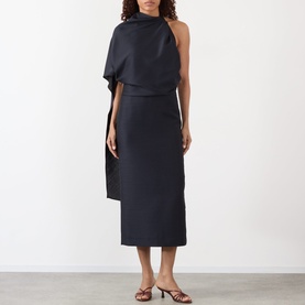 Model wearing Rohe Cape Pencil Dress in Night, featuring asymmetric cape sleeve, open-back detail and midi length, styled with tan heeled mules.