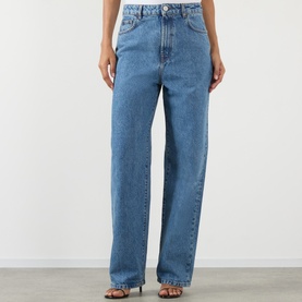 Model wearing Rohe Bruun Straight-Leg Jeans in Heritage Blue; low-rise, straight-leg fit with tobacco stitching and mid-wash finish.