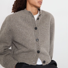 Model wearing Rohe Statement Moulin&eacute; Cardigan in Dark Taupe Melange, round neck, button front, oversized fit, styled with white top.