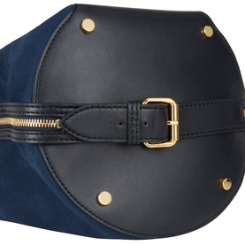 Stella McCartney Appaloosa Bucket Bag in navy, close-up of gold-tone buckle belt strap, zip fastening, and foot studs on faux suede base